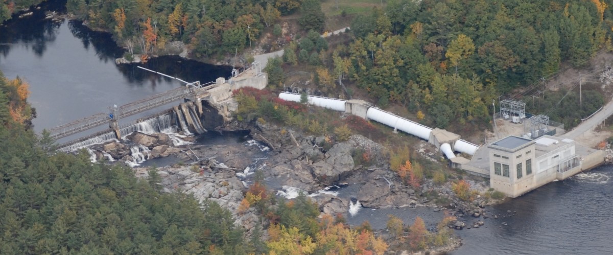 aerial of dam in the fall
